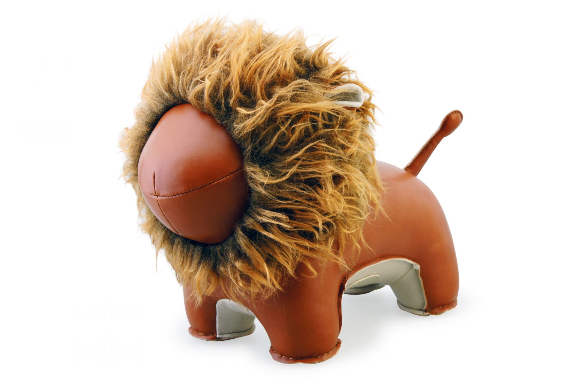 Buchstütze Löwe Lino Tan/Weiß Züny aus Kunstleder mit flauschiger Mähne, dekorativ und funktional.